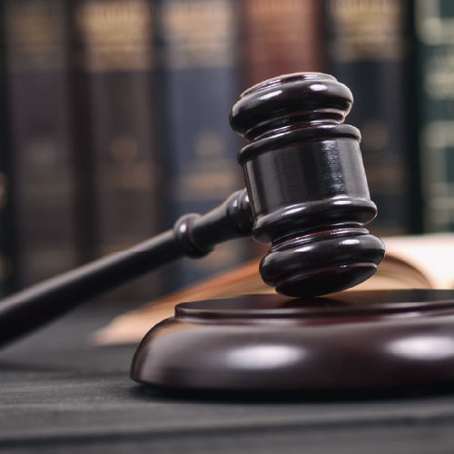 gavel on a table with open book